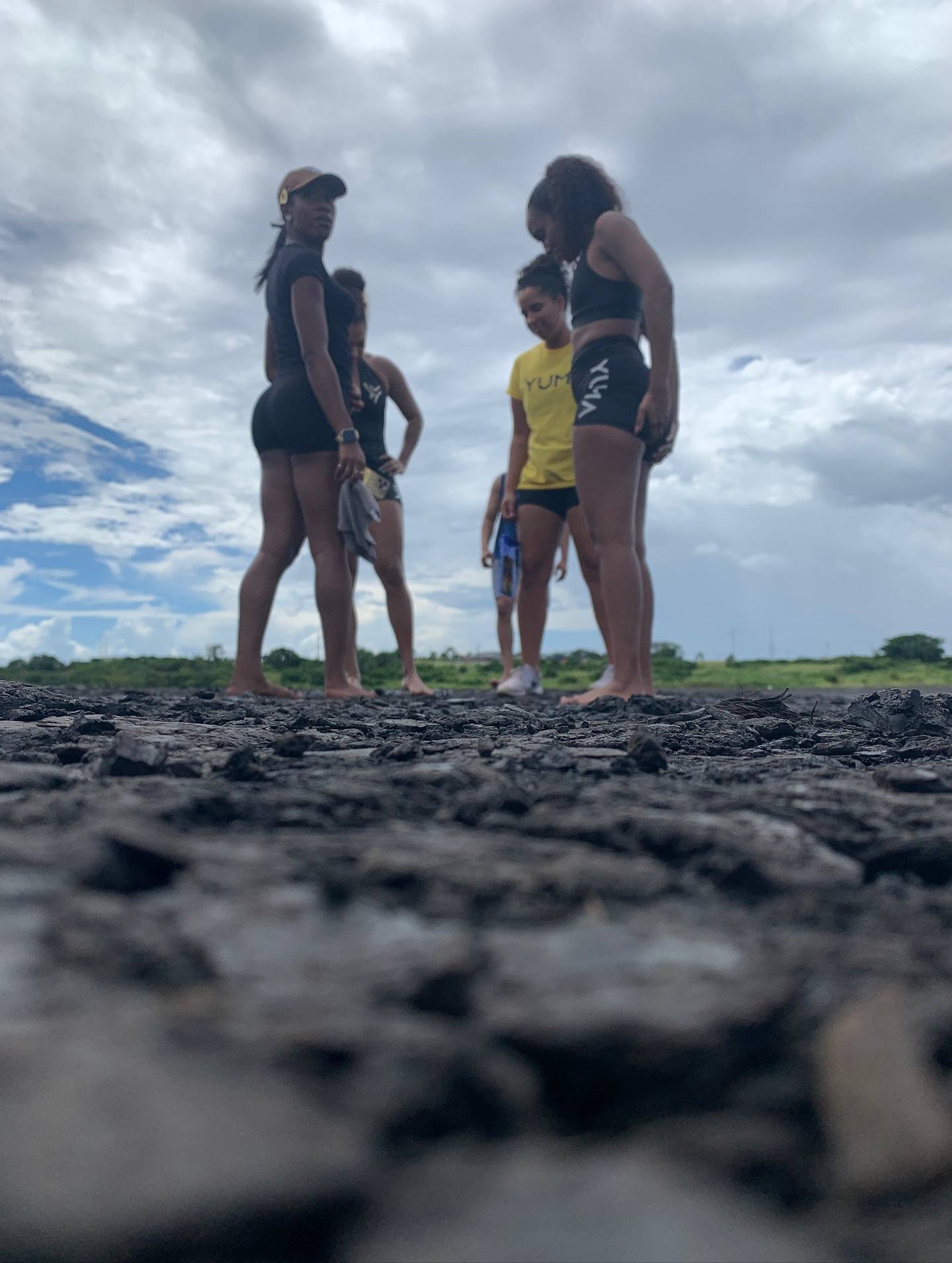 Visitors exploring the Pitch Lake landscape