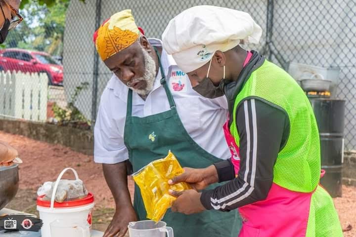 NYLB participant and mentor working together at an outdoor food preparation session.